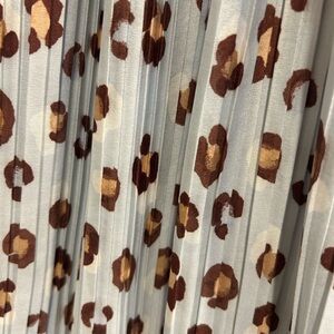 Beaut midi length Ann Taylor skirt. Pale blue with leopard print. Like new!